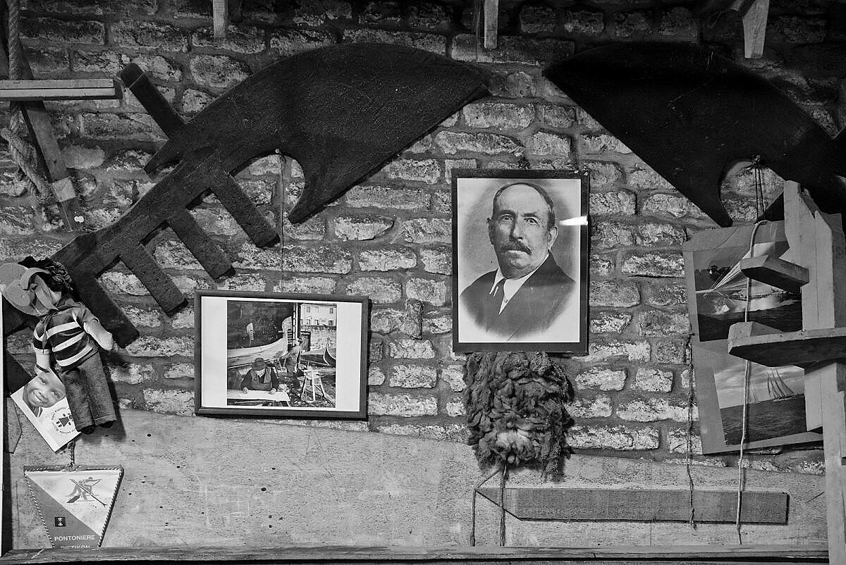 Photo of the founder Domenico Tramontin and other memorabilia on the wall of the squero Tramontin